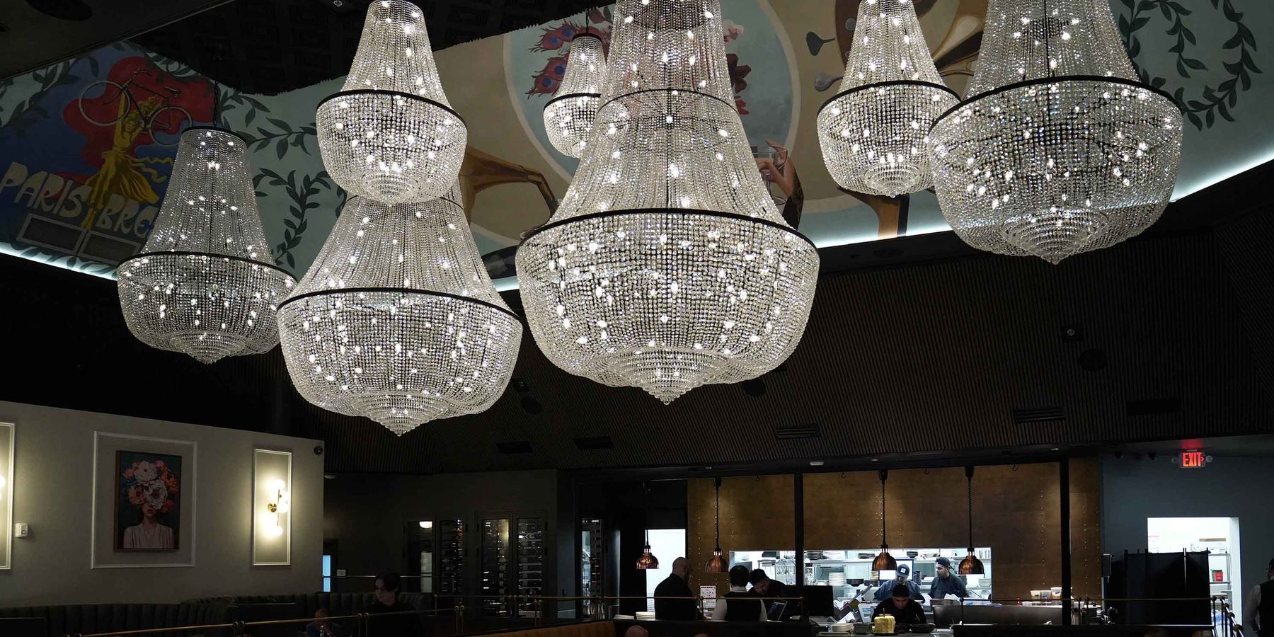 Crystal chandeliers over the Braseria dining room