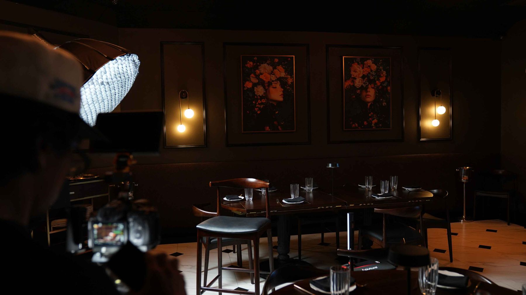 The empty interview chair lit in the Braseria dining room