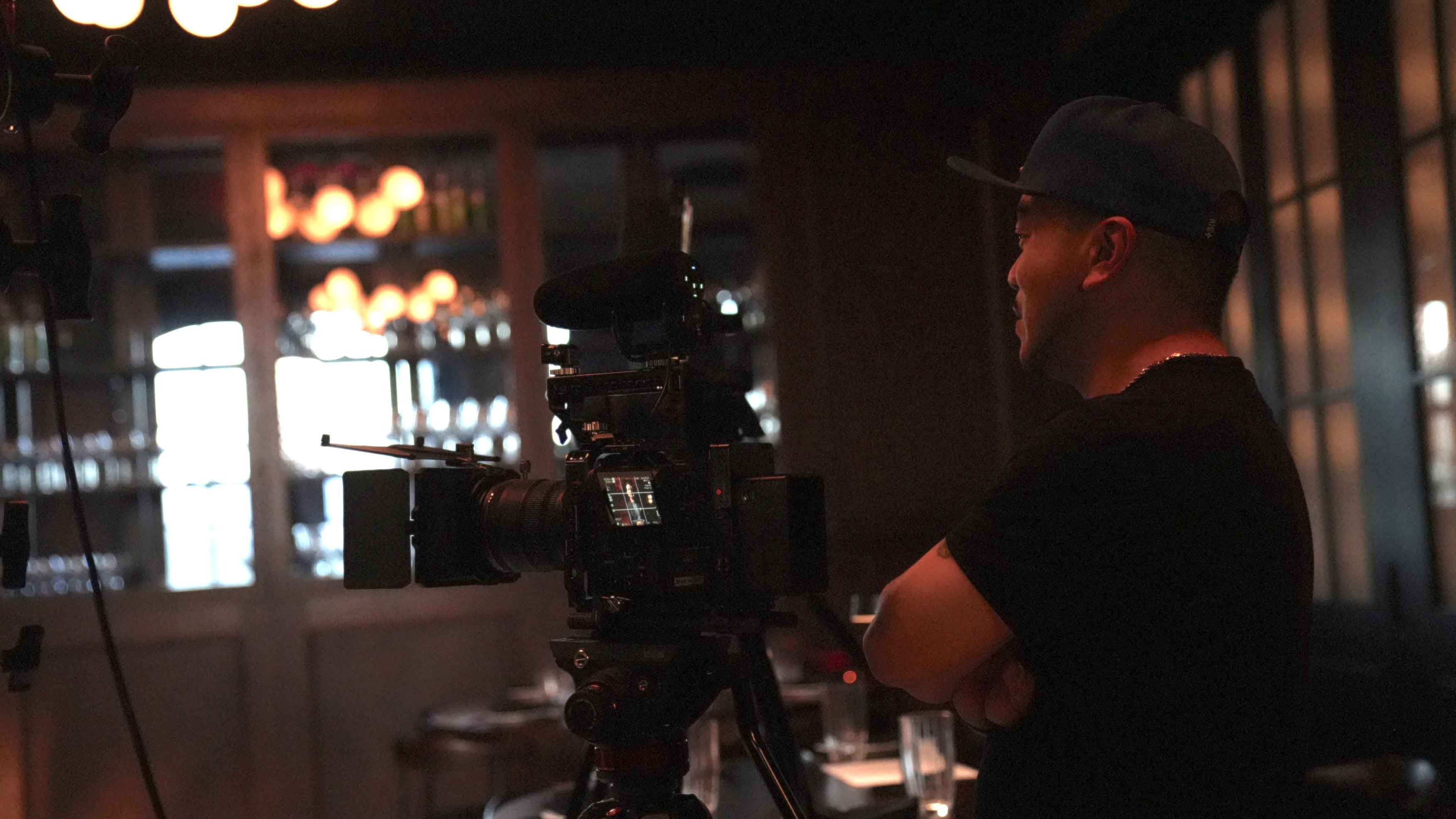 A Foodbox camera operator filming inside Braseria